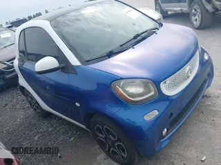 2016 Smart fortwo Passion z VIN WMEFJ5DA0GK054213, wystawiony jako IAAI lot #41734678 z przebiegiem 78 424 mil mil oraz . Historia ofert i sprzedaży dostępna na DreamBid. Obrazek 1.