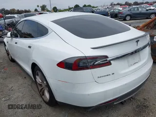 2016 Tesla Model S 90D with VIN 5YJSA1E40GF123543, listed as a IAAI auction lot 42111603 with 126,445 mi miles and . Bid and sale history available at DreamBid. Image 3.