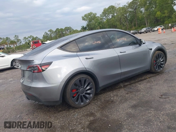 2024 Tesla Model Y Performance with VIN 7SAYGDEF3RA307468, listed as a IAAI auction lot 41805853 with 10,377 mi miles and . Bid and sale history available at DreamBid. Image 4.
