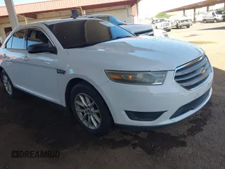 2014 Ford Taurus SE z VIN 1FAHP2D8XEG170512, wystawiony jako IAAI lot #42142683 z przebiegiem 198 526 mil mil oraz . Historia ofert i sprzedaży dostępna na DreamBid. Obrazek 1.