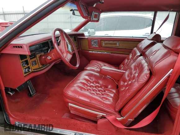 1985 Cadillac Eldorado z VIN 1G6EL5782FE634074, wystawiony jako Copart lot #44520964 z przebiegiem 74 425 mil mil oraz Szkody całkowita. Historia ofert i sprzedaży dostępna na DreamBid. Obrazek 7.