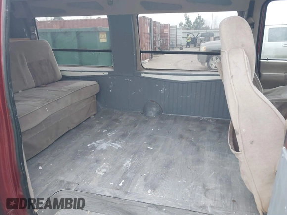 1999 Ford Econoline Cargo with VIN 1FDRE14W0XHB06565, listed as a IAAI auction lot 41496511 with 165,268 mi miles. Bid and sale history available at carsss.com. Image 8.