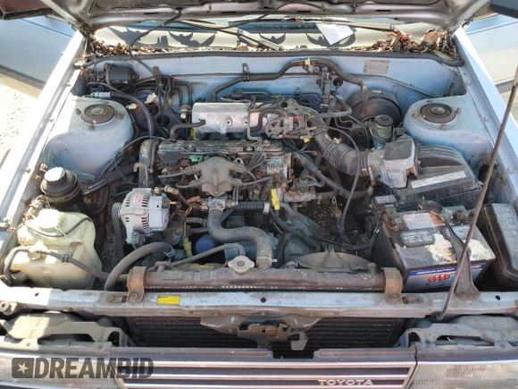 1986 Toyota Camry z VIN JT2SV12E3G6021210, wystawiony jako Copart lot #49623985 z przebiegiem 144 064 mil mil oraz Czysty tytuł • Clean title. Historia ofert i sprzedaży dostępna na DreamBid. Obrazek 11.