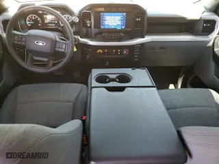 2023 Ford F-150 XL with VIN 1FTEW1CB6PKD83299, listed as a Copart auction lot 67133984 with 14,693 mi miles and Salvage Title. Bid and sale history available at carsss.com. Image 8.