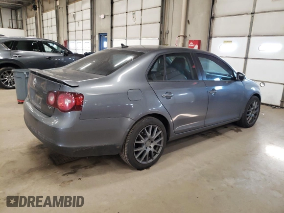 2009 Volkswagen Jetta z VIN 3VWRA71K59M032737, wystawiony jako Copart lot #43270605 z przebiegiem 120 104 mil mil oraz Szkoda całkowita • Salvage title. Historia ofert i sprzedaży dostępna na DreamBid. Obrazek 3.
