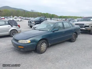 1996 Toyota Camry DX with VIN 4T1BG12K3TU829839, listed as a IAAI auction lot 42085170 with 266,741 mi miles. Bid and sale history available at carsss.com. Image 2.