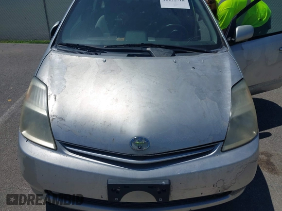 2005 Toyota Prius z VIN JTDKB20U657012346, wystawiony jako IAAI lot #42275718 z przebiegiem 180 851 mil mil oraz . Historia ofert i sprzedaży dostępna na DreamBid. Obrazek 6.