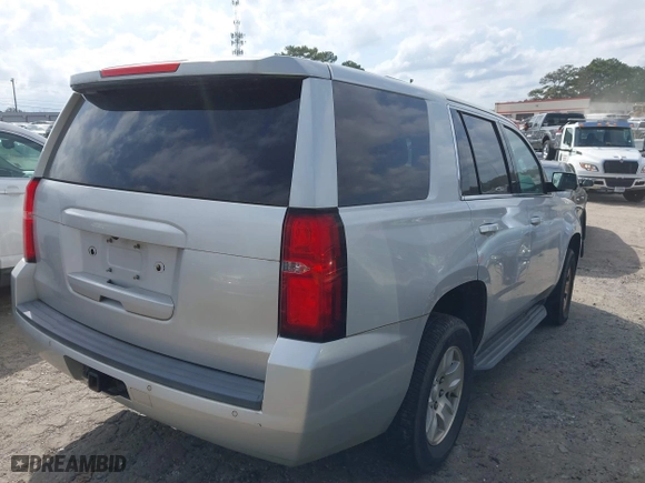 2017 Chevrolet Tahoe Commercial with VIN 1GNLCDECXHR238788, listed as a IAAI auction lot 41718161 with 129,880 mi miles. Bid and sale history available at carsss.com. Image 4.