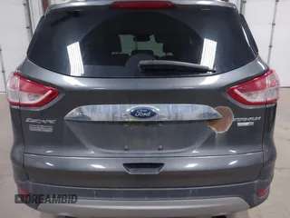 2016 Ford Escape Titanium with VIN 1FMCU9J90GUB35593, listed as a IAAI auction lot 42309020 with 173,019 mi miles and . Bid and sale history available at DreamBid. Image 16.