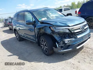 2020 Honda Pilot Touring 8-Passenger with VIN 5FNYF6H93LB034009, listed as a IAAI auction lot 42090993 with 73,325 mi miles and . Bid and sale history available at carsss.com. Image 1.
