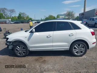 2018 Audi Q3 Premium with VIN WA1ECCFS3JR016577, listed as a IAAI auction lot 42177891 with 91,876 mi miles and . Bid and sale history available at DreamBid. Image 14.