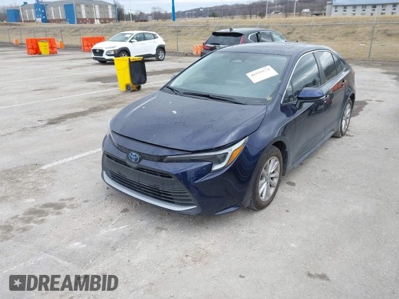 2023 Toyota Corolla Hybrid LE with VIN JTDBCMFE7PJ001872, listed as a IAAI auction lot 41529174 with 13,838 mi miles. Bid and sale history available at carsss.com. Image 2.