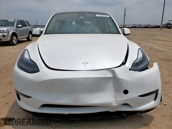 2024 Tesla Model Y Long Range with VIN 7SAYGDEE6RA290124, listed as a Copart auction lot 57662385 with 14,751 mi miles and Salvage title. Bid and sale history available at DreamBid. Image 5.