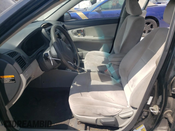 2008 Kia Spectra EX with VIN KNAFE121X85525733, listed as a Copart auction lot 66246444 with 166,211 mi miles and Salvage Title. Bid and sale history available at DreamBid. Image 7.