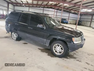 2003 Jeep Grand Cherokee Laredo with VIN 1J4GX48S13C601387, listed as a Copart auction lot 60544295 with 217,485 mi miles and Salvage title. Bid and sale history available at DreamBid. Image 4.
