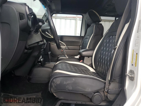 2012 Jeep Wrangler Unlimited Sport z VIN 1C4BJWDG9CL169159, wystawiony jako Copart lot #83647894 z przebiegiem 120 684 mil mil oraz Szkoda całkowita • Salvage title. Historia ofert i sprzedaży dostępna na DreamBid. Obrazek 7.
