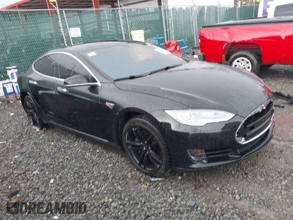 2014 Tesla Model S 60 with VIN 5YJSA1H18EFP28053, listed as a IAAI auction lot 41191521 with 82,207 mi miles and . Bid and sale history available at DreamBid. Image 1.