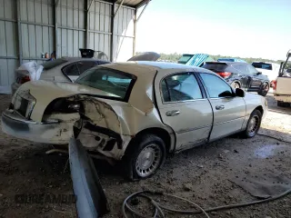 1999 Lincoln Town Car Executive with VIN 1LNHM81W2XY658371, listed as a Copart auction lot 60249045 with 191,266 mi miles and Salvage title. Bid and sale history available at DreamBid. Image 3.