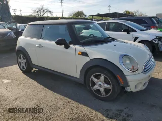 2010 MINI Hardtop with VIN WMWMF3C52ATZ65593, listed as a Copart auction lot 50107445 with 105,389 mi miles and Salvage title. Bid and sale history available at DreamBid. Image 4.