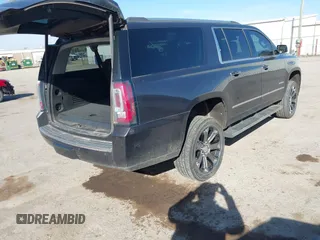 2015 GMC Yukon XL Denali with VIN 1GKS2JKJ9FR634771, listed as a IAAI auction lot 41676218 with 73,271 mi miles. Bid and sale history available at carsss.com. Image 4.