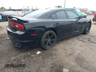 2013 Dodge Charger SXT with VIN 2C3CDXHG2DH558465, listed as a IAAI auction lot 41563714 with 151,052 mi miles. Bid and sale history available at carsss.com. Image 4.