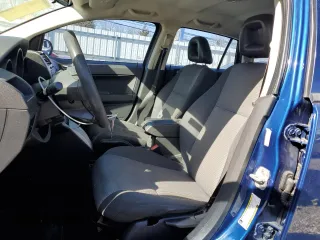2009 Dodge Caliber SXT with VIN 1B3HB48A09D116274, listed as a Copart auction lot 49222585 with 144,852 mi miles and Salvage Title. Bid and sale history available at DreamBid. Image 7.