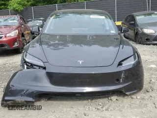 2025 Tesla Model 3 Long Range with VIN 5YJ3E1EAXSF878982, listed as a Copart auction lot 60302315 with 4,312 mi miles and Salvage title. Bid and sale history available at DreamBid. Image 5.