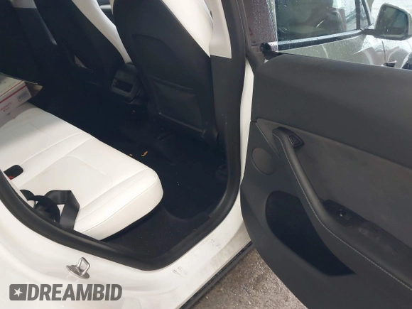 2023 Tesla Model Y Long Range with VIN 7SAYGDEE7PA100523, listed as a IAAI auction lot 40399455 with 18,885 mi miles and . Bid and sale history available at DreamBid. Image 8.