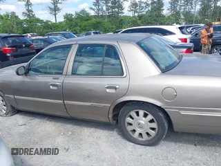 2003 Mercury Grand Marquis LS Premium z VIN 2MEFM75WX3X683205, wystawiony jako IAAI lot #42177139 z przebiegiem 200 521 mil mil oraz . Historia ofert i sprzedaży dostępna na DreamBid. Obrazek 14.