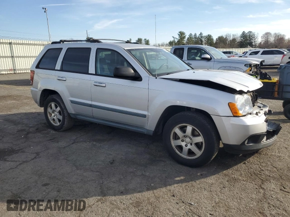 2009 Jeep Grand Cherokee Laredo with VIN 1J8HR48P89C552691, listed as a Copart auction lot 82080964 with 100,876 mi miles and Salvage Title. Bid and sale history available at carsss.com. Image 4.