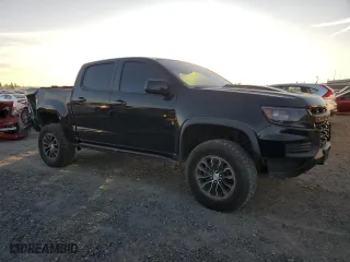 2021 Chevrolet Colorado 4WD ZR2 with VIN 1GCGTEEN6M1169379, listed as a Copart auction lot 87615955 with 34,487 mi miles and Salvage Title. Bid and sale history available at carsss.com. Image 4.
