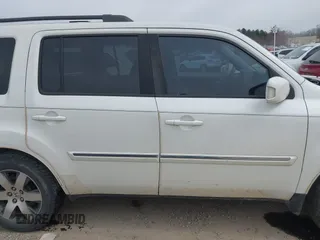 2013 Honda Pilot Touring with VIN 5FNYF3H98DB025516, listed as a IAAI auction lot 41767097 with 202,908 mi miles and . Bid and sale history available at DreamBid. Image 13.