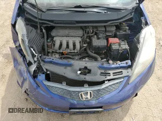 2009 Honda Fit with VIN JHMGE88229S049270, listed as a Copart auction lot 56935235 with 118,649 mi miles and Salvage title. Bid and sale history available at DreamBid. Image 11.