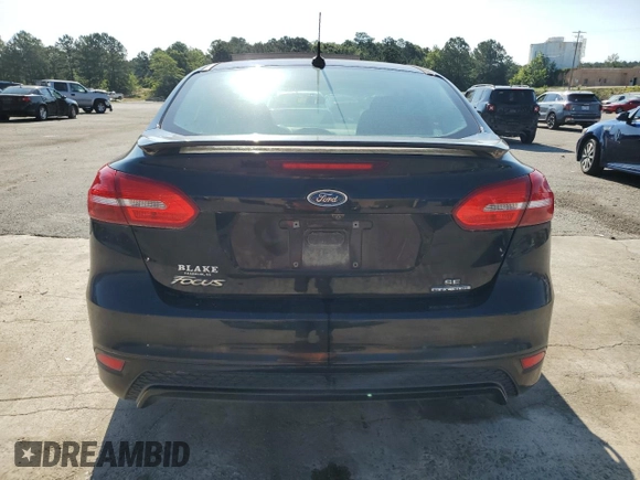 2016 Ford Focus SE z VIN 1FADP3F2XGL261707, wystawiony jako Copart lot #59078565 z przebiegiem 79 820 mil mil oraz Szkoda całkowita • Salvage title. Historia ofert i sprzedaży dostępna na DreamBid. Obrazek 6.