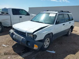 1999 Subaru Forester L with VIN JF1SF6353XH741228, listed as a IAAI auction lot 39377894 with 156,243 mi miles. Bid and sale history available at carsss.com. Image 2.