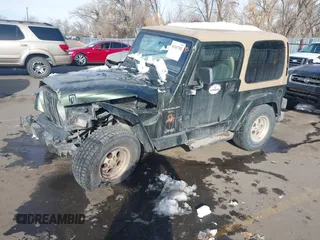 1998 Jeep Wrangler Sahara z VIN 1J4FY49S3WP744619, wystawiony jako IAAI lot #41107702 z przebiegiem 105 432 mil mil oraz . Historia ofert i sprzedaży dostępna na DreamBid. Obrazek 2.