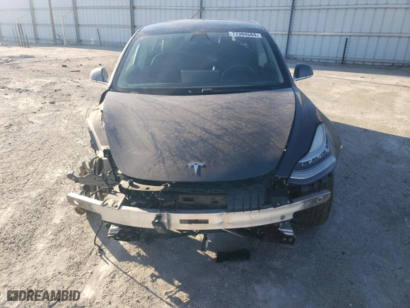 2020 Tesla Model 3 Standard Range Plus with VIN 5YJ3E1EA7LF803660, listed as a Copart auction lot 77394564 with 61,062 mi miles and Salvage Title. Bid and sale history available at carsss.com. Image 5.