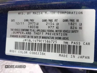 2012 Mazda 3 i Touring with VIN JM1BL1V79C1586725, listed as a IAAI auction lot 41711117 with 90,309 mi miles. Bid and sale history available at carsss.com. Image 9.