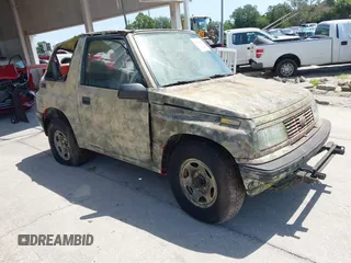1995 Chevrolet Tracker z VIN 2CNBJ1869S6911342, wystawiony jako IAAI lot #42265392 z przebiegiem 121 944 mil mil oraz . Historia ofert i sprzedaży dostępna na DreamBid. Obrazek 1.