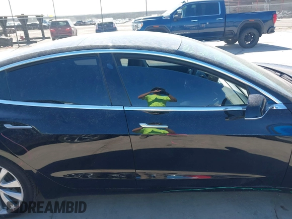 2020 Tesla Model 3 Standard Range Plus with VIN 5YJ3E1EAXLF614002, listed as a IAAI auction lot 41758898 with 42,363 mi miles and . Bid and sale history available at DreamBid. Image 13.