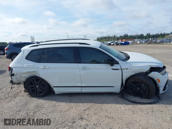2022 Volkswagen Tiguan SE R-Line Black z VIN 3VVCB7AX5NM007401, wystawiony jako IAAI lot #41630458 z przebiegiem 55 635 mil mil oraz . Historia ofert i sprzedaży dostępna na DreamBid. Obrazek 14.