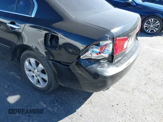 2007 Kia Optima EX with VIN KNAGE124175095989, listed as a IAAI auction lot 41637247 with 174,944 mi miles. Bid and sale history available at carsss.com. Image 6.