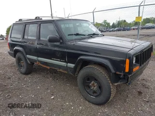 2000 Jeep Cherokee z VIN 1J4FF48S3YL223529, wystawiony jako IAAI lot #42337975 z przebiegiem 256 627 mil mil oraz . Historia ofert i sprzedaży dostępna na DreamBid. Obrazek 1.