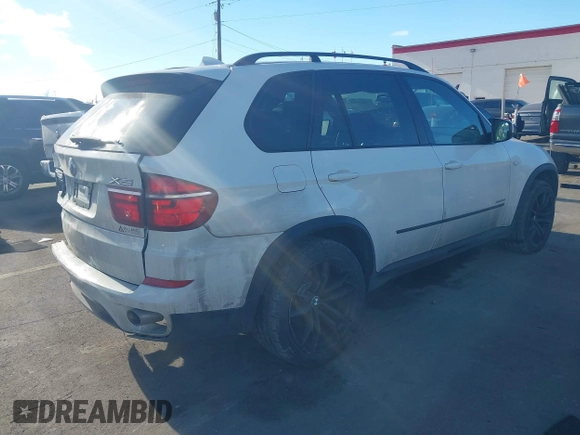2012 BMW X5 35d with VIN 5UXZW0C56CL665631, listed as a IAAI auction lot 41055705 with 179,408 mi miles and . Bid and sale history available at DreamBid. Image 4.