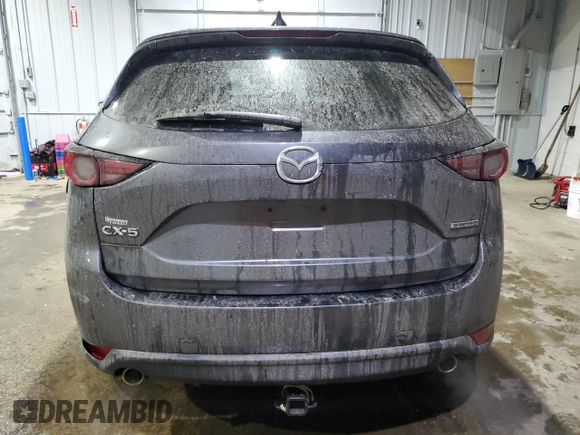 2021 Mazda CX-5 Grand Touring with VIN JM3KFADM5M0428282, listed as a Copart auction lot 42567825 with 33,763 mi miles and Salvage Title. Bid and sale history available at carsss.com. Image 6.