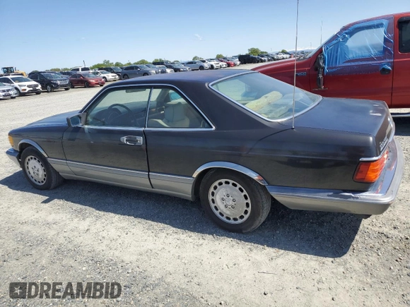 1987 Mercedes-Benz 560 with VIN WDBCA45D3HA358923, listed as a Copart auction lot 52143895 with 127,974 mi miles and Clean Title. Bid and sale history available at DreamBid. Image 2.