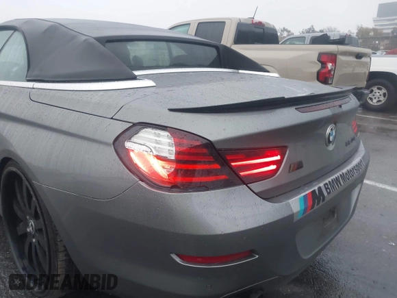 2012 BMW 6 Series 650i with VIN WBALZ3C5XCDL70748, listed as a IAAI auction lot 41502640 with 102,519 mi miles. Bid and sale history available at carsss.com. Image 6.