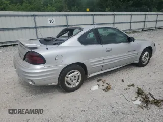 2001 Pontiac Grand Am with VIN 1G2NE12TX1M668035, listed as a Copart auction lot 59700585 with 60,965 mi miles and Salvage title. Bid and sale history available at DreamBid. Image 3.