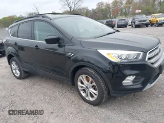 2017 Ford Escape SE with VIN 1FMCU9GD0HUC58128, listed as a IAAI auction lot 42078045 with 125,503 mi miles. Bid and sale history available at carsss.com. Image 1.