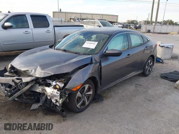 2019 Honda Civic Sedan LX with VIN 19XFC2F60KE018100, listed as a IAAI auction lot 41908486 with 124,357 mi miles. Bid and sale history available at carsss.com. Image 2.